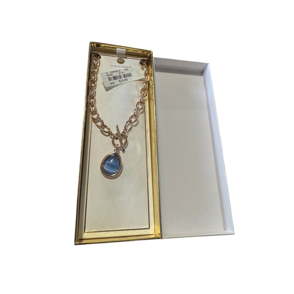 True to form new in box with tags blue 18 inch necklace with gold color chain.